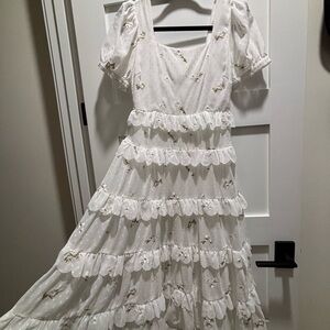 Elegant White Dress with Floral Accents ruffles